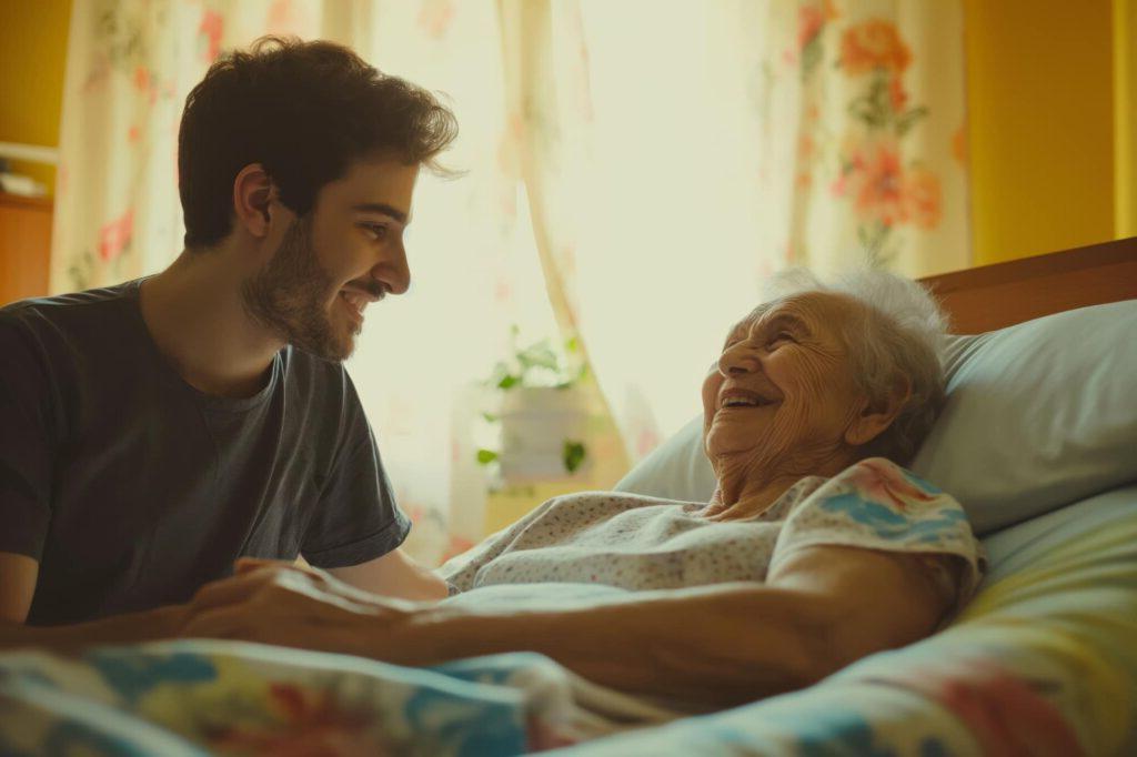 A grandson visiting with his grandmother in a hospital bed.